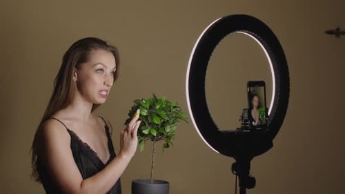 Woman Vlogging About Plants With Ring Light