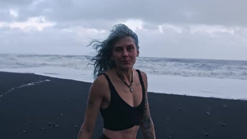 Carefree Cool Girl Enjoying Black Sand Beach