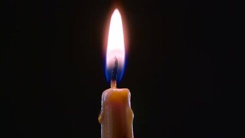 candle cigarette lighter Hand with a Cigarette Lighter Ignites One Candle. Black Background. Close Up candle cigarette lighter Hand with a Cigarette Lighter Ignites One Candle. Black Background. Close Up