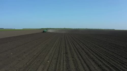 Working On A Tractor In The Field