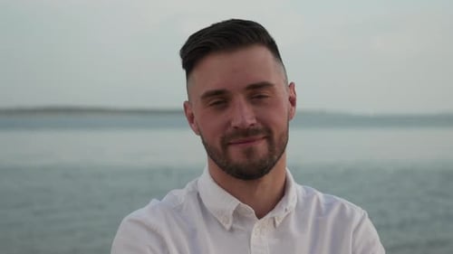 Smiling Man Posing at the Beach