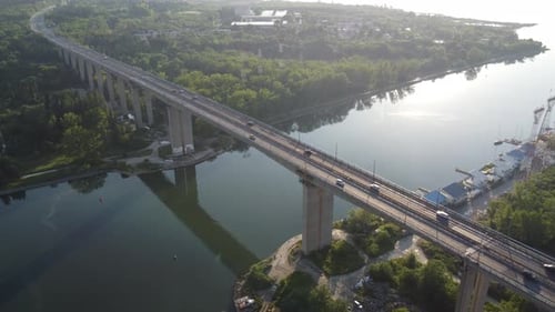 Aerial View of a Bridge Over a Large River with Heavy Traffic