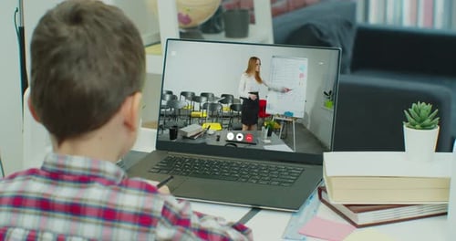 Boy Attends Online Class at Home