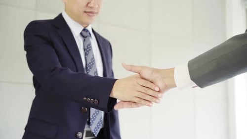 Businessmen Handshake in Modern Office Setting