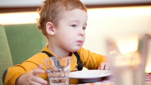 Boy at the Table in Cafe