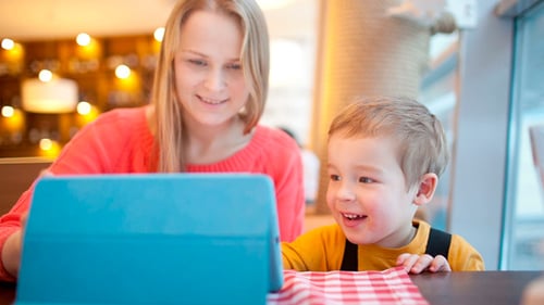 Mother and Child Play Together on Tablet Device