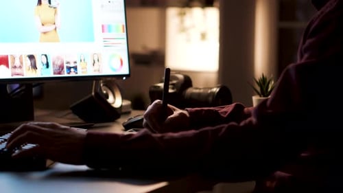 Close Up of Young Photographer Using Digitizer