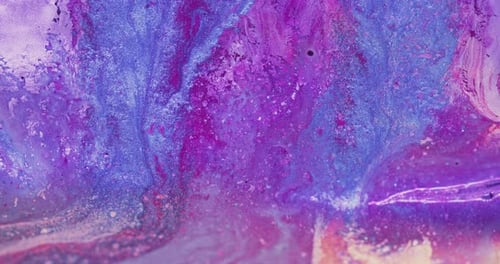Abstract Footage of Blue and Pink Shimmering Paint