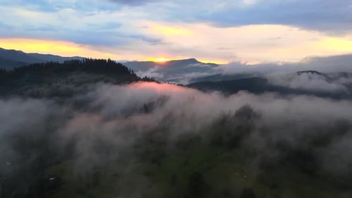 Majestic Mountain Landscape with Fog at Sunrise