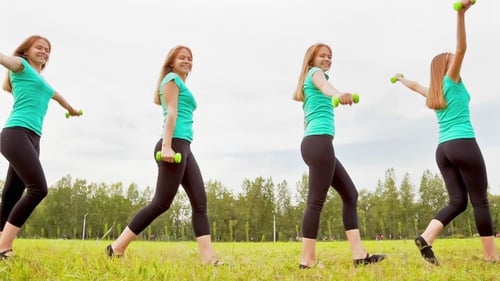 Young Woman With Dumbbells
