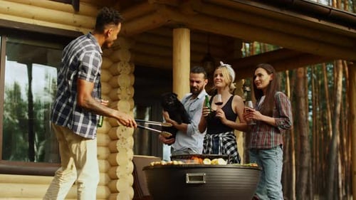 Cheerful Friends Having Rest on Grill Party Outdoors