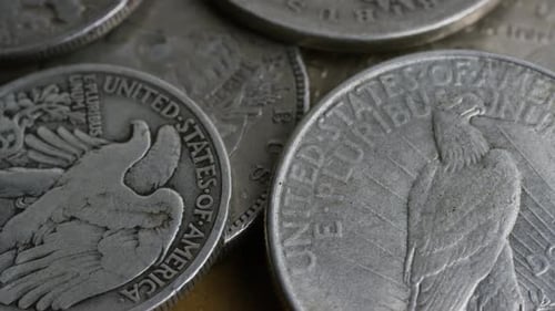 Rotating stock footage shot of antique American coins - MONEY 0099