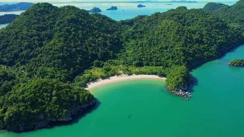 An aerial view of the coast, mountains with many beautiful islands