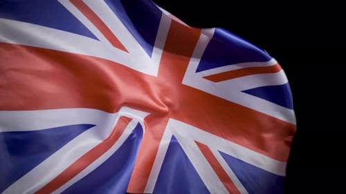United Kingdom Flag Waving in a Dark Space