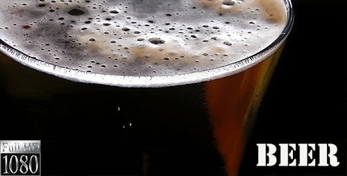 Close Up of Dark Beer Bubbles in Glass
