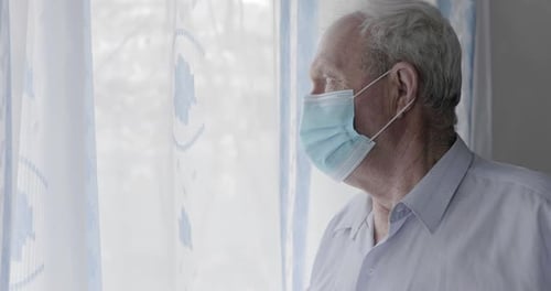 Adult with Gray Hair Wearing a Face Mask