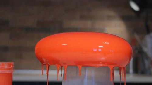 Glossy Orange Dessert Drips Close Up
