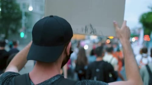 Crowd of People Marching in an Urban Protest
