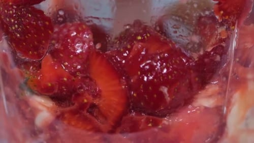 Close Up Sliced Strawberries and Banana in Blender