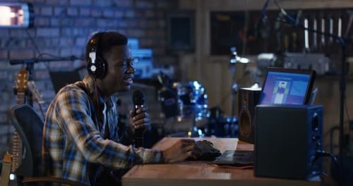 Young Man Singing in Studio
