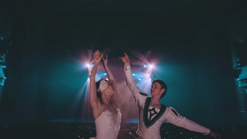 Ballet Dancers Performing On Stage in Bright Lights