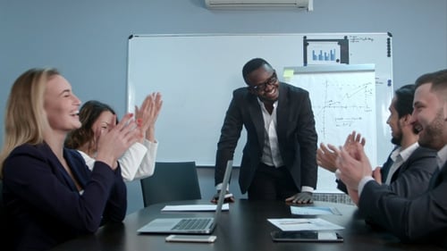 Business Team Celebrates Success in Modern Office