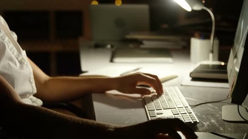 Woman Working at Computer Late at Night