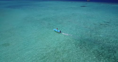 Tropical flying island view of a white paradise beach and blue water background in best quality 4K