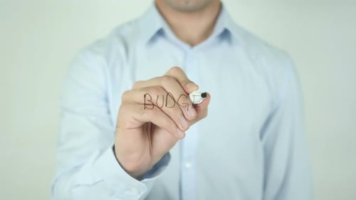 Writing Budget on Clear Whiteboard