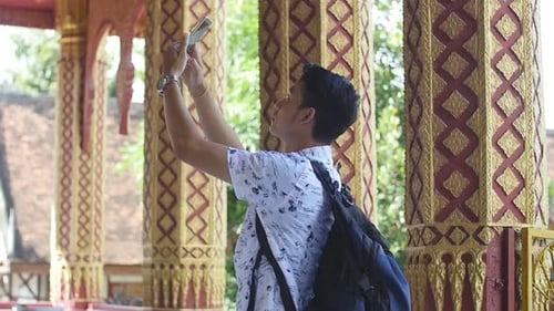 Man Taking Photo In Temple