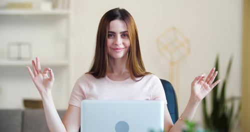 Woman Meditating at Desk During Work Break