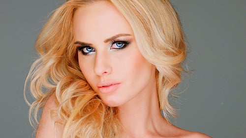 Model Posing in a Studio with Blonde Hair