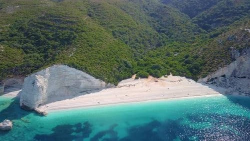 Holiday vacation scene. Fteri beach on Kefalonia Island, Greece. Most beautiful pebble beach with cl