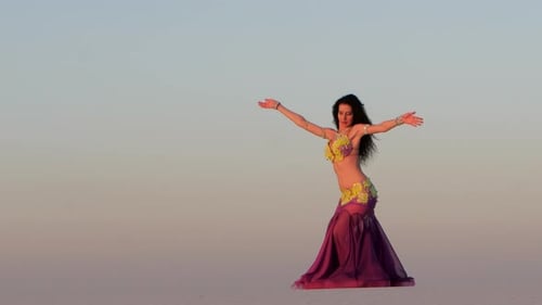 Woman Belly Dancing in Desert at Sunrise