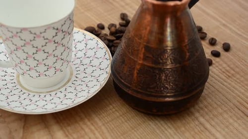 Coffee Beans, Pot, and Cup on Wooden Table