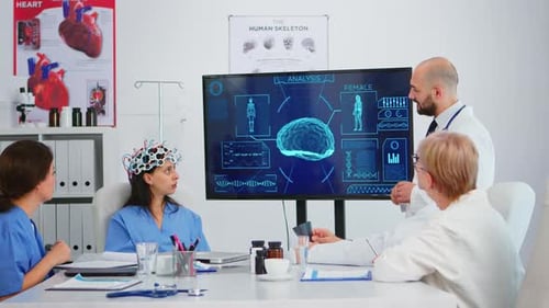 Team of Doctors Analysing Brain Functions Using High Tech