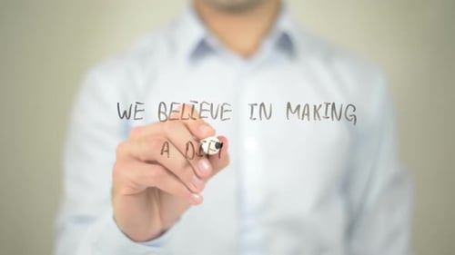 We Believe in Making a Difference, Businessman Writing on Transparent Screen