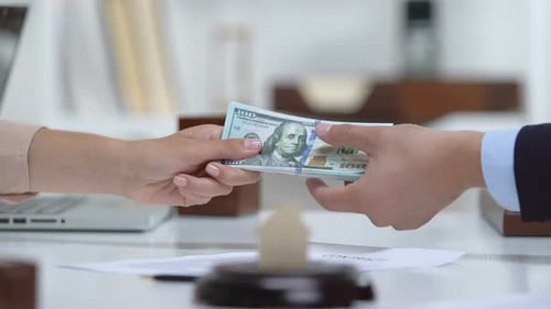 Woman Giving Realtor Agent Dollars, Paper House on Table, Real Estate Purchase