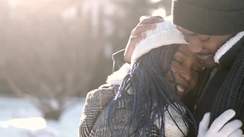 Couple Embracing in Winter Sunlight