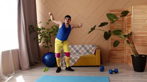 Overweight Man in Retrostyle Sport Uniform Dances in Living Room Dining Fitness Exercises Front View