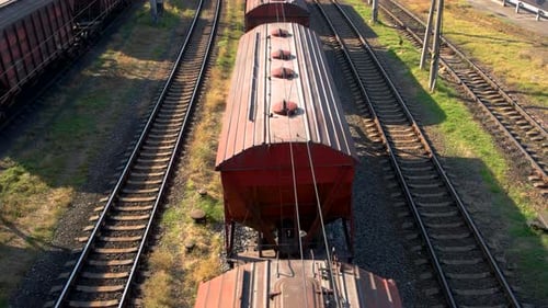 Aerial View of Train Cars Moving on Tracks