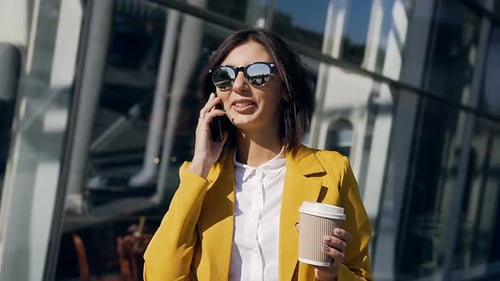 Business Woman in Suit Walking Near Business Centre in the City