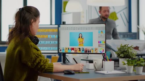 Female Photographer Edits Photos in Creative Media Agency Office