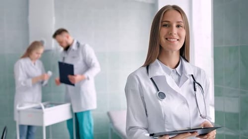 Portrait Female Medical Specialist with Stethoscope Surrounded By Working Environment at Hospital