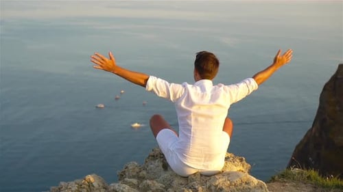 Man Outdoor on Edge of Cliff Seashore