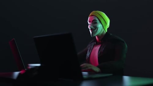 Hacker with Anonymous Mask Write a Code