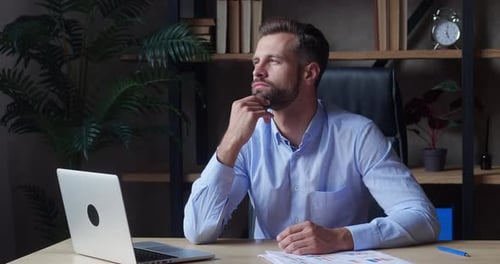 Handsome Businessman Smiling in New Office