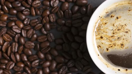 Aerial Shot of Cup of Coffee with Beans