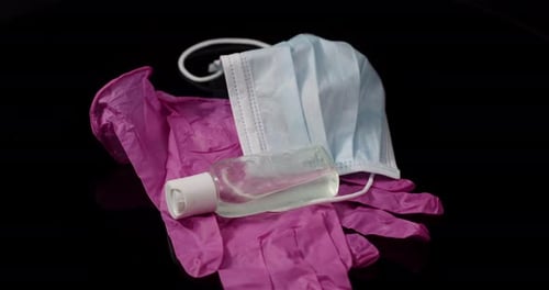 Surgical Mask, Gloves, and Hand Sanitizer Close Up