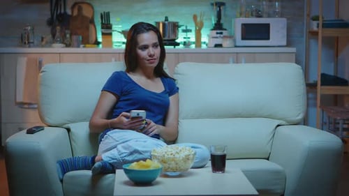 Lady Using Phone and Watching Tv